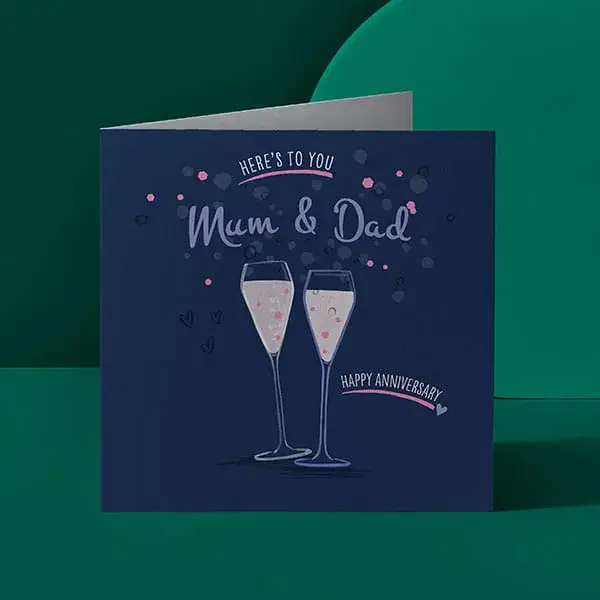 Navy anniversary card for Mum and Dad with illustrated champagne glasses and celebratory text on a green background